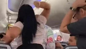 Uçakta kıskançlık krizi! Sevgilisinin kafasında laptop kırdı
